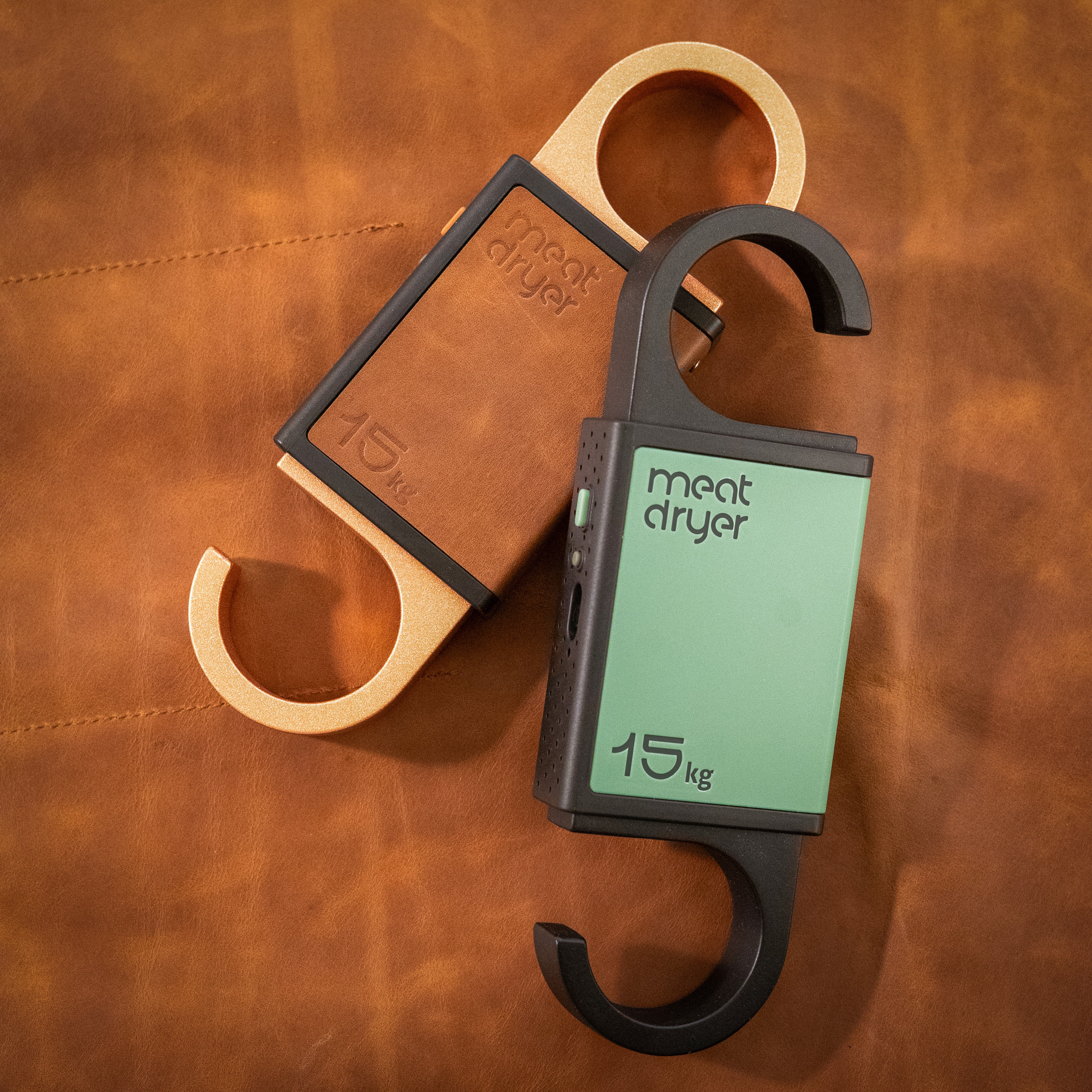 Meatdryer smart hooks with mobile app on a brown leather background