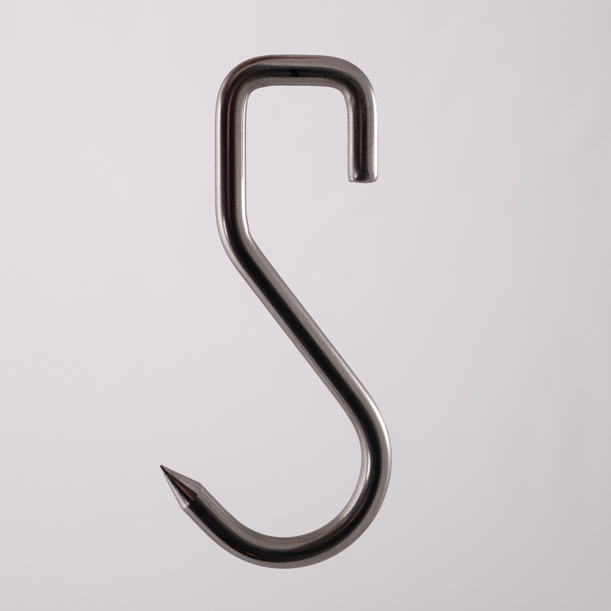 Food safe sharp stainless steel meat hook on a gray background